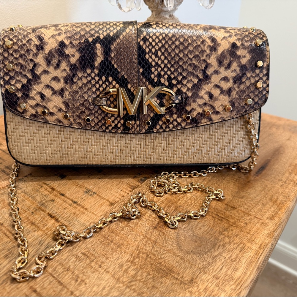Michael Kors Crossbody Bag. Like new. Does have stain inside. See picture.